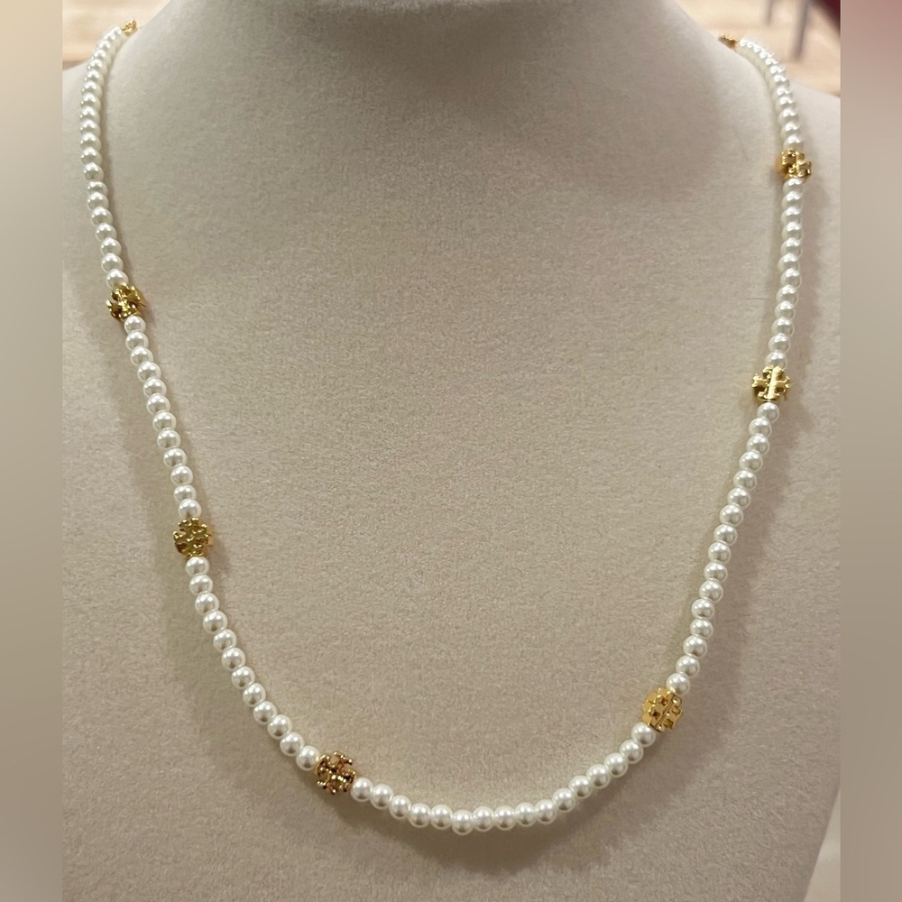 Tory Burch Moondance Pearl Necklace featuring beveled Double T logos.
